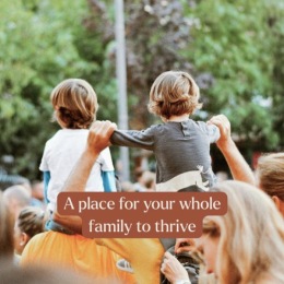 a family of brothers on their mother and father's shoulders